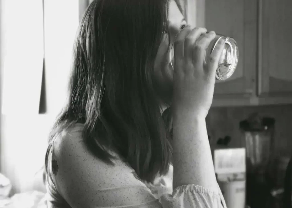 lady drinking water from a glass